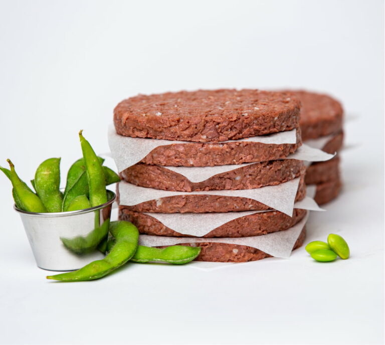 stack of plant-based burger patties with edamame